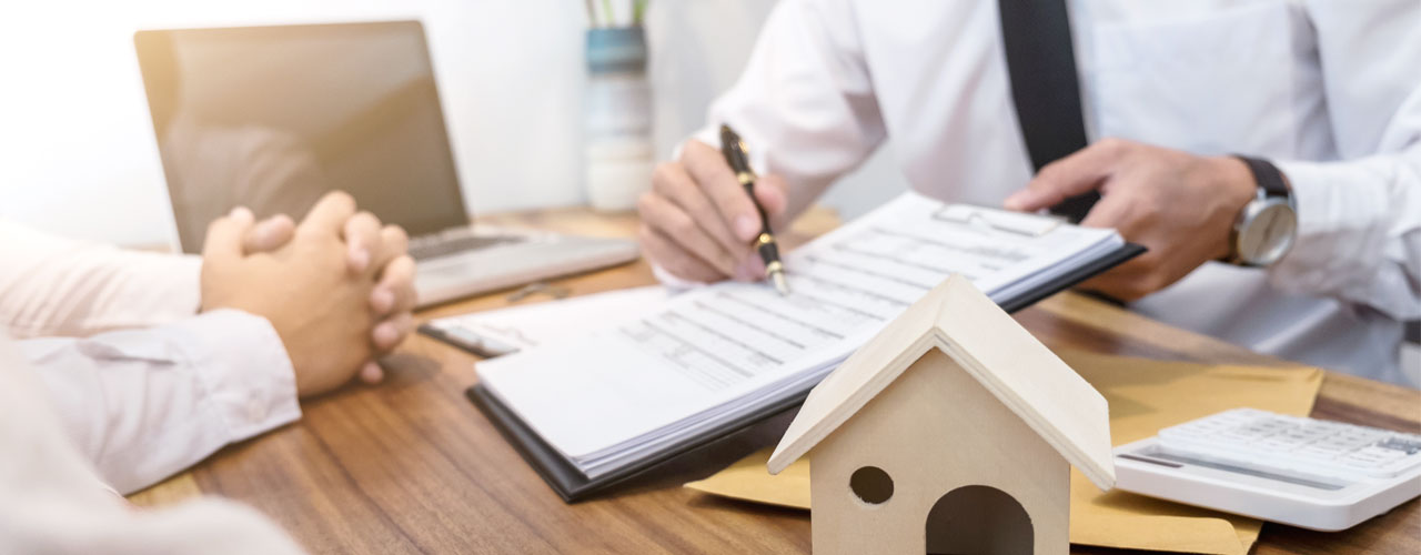 A property contract being reviewed with clients